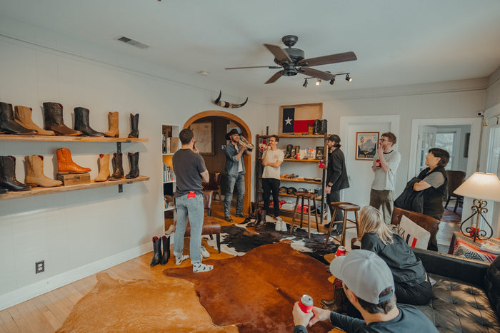 A private event in the main room at Chisos HQ, with boots displayed along the wall
