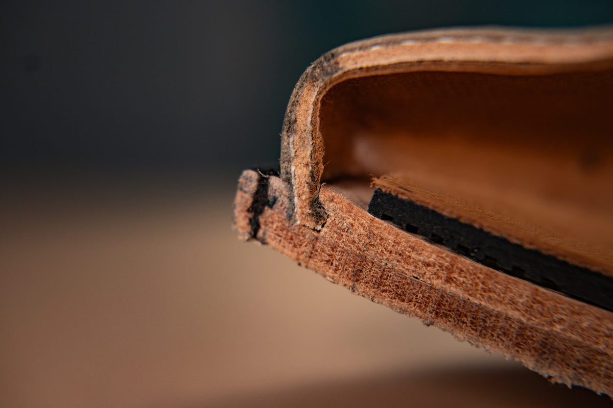 A close-up of the cut No. 2 toe shows the leather outsole, welt and structural leather insole.